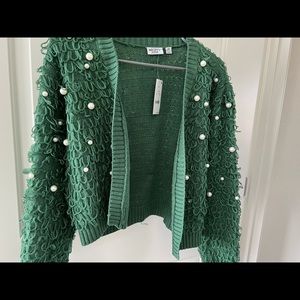 Green Target Sweater with pearls.